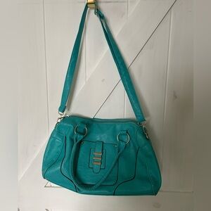 Teal blue handbag. Versatile straps, roomy, all zippers functional. Spring ready